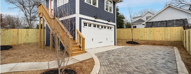 Paver driveway and exterior stair to the ADU entrance above the garage at the Lake Claire project